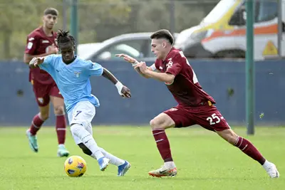 Sana Fernandes of SS Lazio compete for the ball with Alessandro Dellavalle of Torino FC during the Primavera 1 match between SS Lazio U 19 and FC Torino U19 at the Formello sport centre on November 11, 2023 in Rome, Italy.