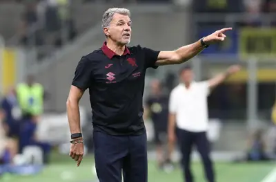 Torino FC coach Marco Baroni issues instructions to his players during the Serie A match between FC Internazionale and Torino FC at Giuseppe Meazza Stadium on August 25, 2025 in Milan, Italy.