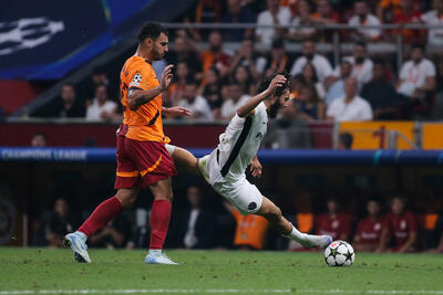 Jaouen Hadjam of Young Boys is tackled by Kaan Ayhan of Galatasaray during the UEFA Champions League match between Galatasaray and Young Boys at Rams Park on August 27, 2024 in Istanbul, Turkey.