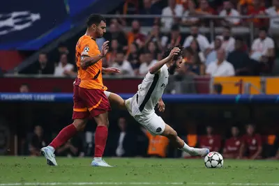 Jaouen Hadjam of Young Boys is tackled by Kaan Ayhan of Galatasaray during the UEFA Champions League match between Galatasaray and Young Boys at Rams Park on August 27, 2024 in Istanbul, Turkey.