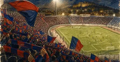 Tifosi rossoblù sugli spalti di uno stadio durante una partita serale